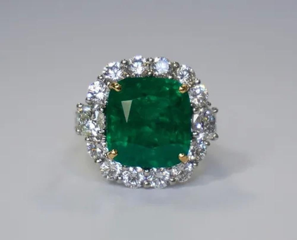 Emerald Weight: 11.05 ct, Diamond Weight: 4.17 ct, Metal: Platinum, Metal Weight: 12.77 gm, Ring Size: 6, Shape: Cushion, Color: Vivid Green, Hardness: 7.5-8, Birthstone: May, Origin: Zambia, CD Certified