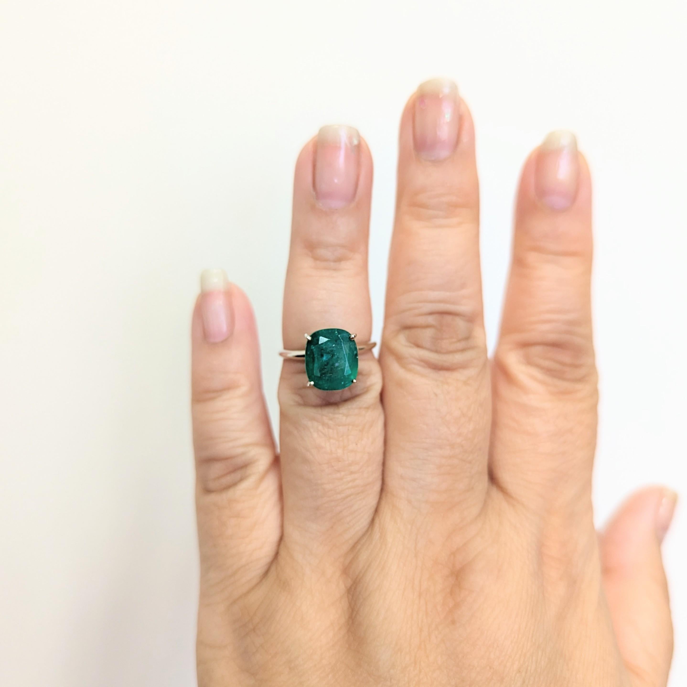 Beautiful 5.09 ct. emerald cushion in a handmade 14k white gold mounting.  Ring size 6.5.