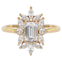 Verlobungsring mit 0,70 Karat Diamanten im Smaragdschliff und eleganter Verzierung, Charlotte