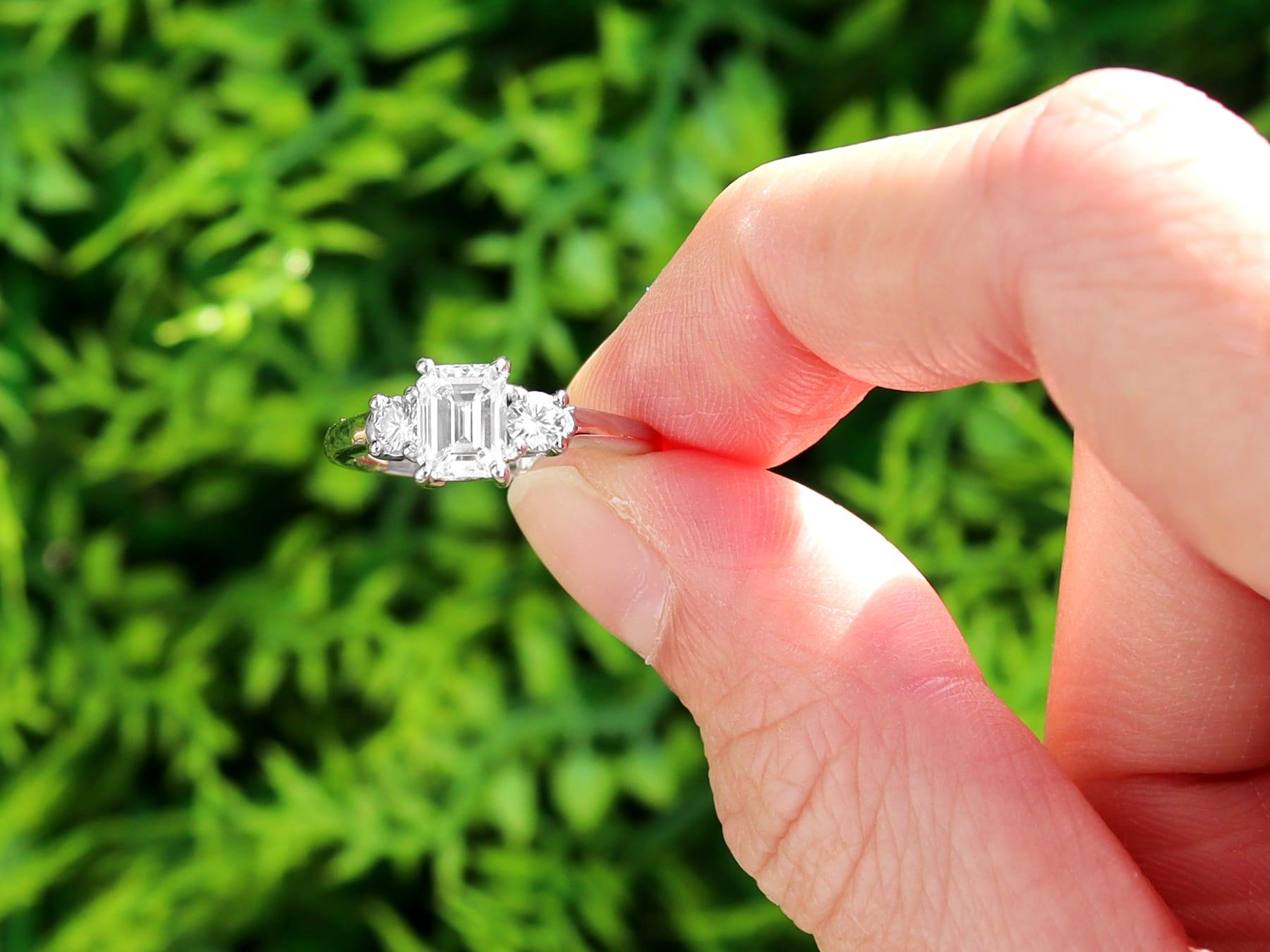 An exceptional, fine and impressive contemporary 1.04 carat emerald cut diamond solitaire with diamond set shoulders, in 18 karat white gold; part of our contemporary jewelry / estate jewelry collections.

This impressive contemporary emerald cut