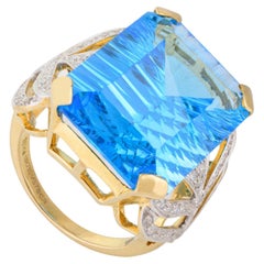 Bague cocktail en or jaune 18 carats exclusive avec topaze bleue taille émeraude 23,45 carats
