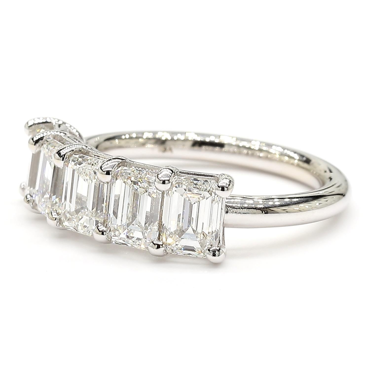 This very impressive *Emerald Cut* Halfway Eternity White Diamond Ring is a testament to fine craftsmanship and timeless design. Perfect for those who appreciate the beauty of natural diamonds, this ring offers a balance of luxury and tasteful