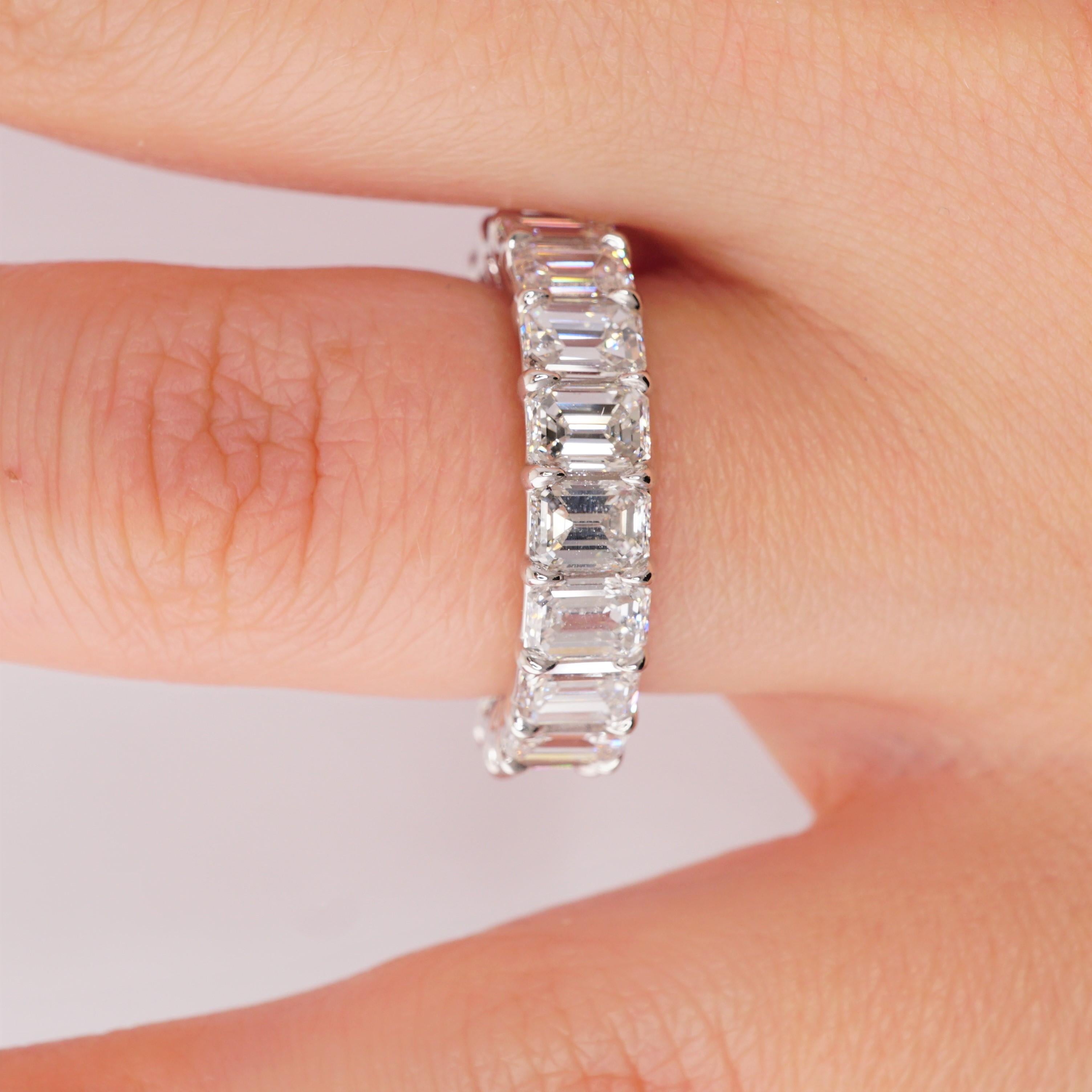 Diamond Eternity Band set in Platinum. 19 Emerald cut diamonds are D-E-F VVS2-VS2 . Carat weight = 5.85 ct. Total ring weight 6.82 grams.
Ring size 5.5. Can be sized upon request. This ring is customizable, price may vary depending on modifications