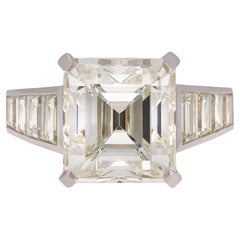Emerald-Cut 6.95 Carat GIA Diamond Flanked Solitaire Ring, circa 1970