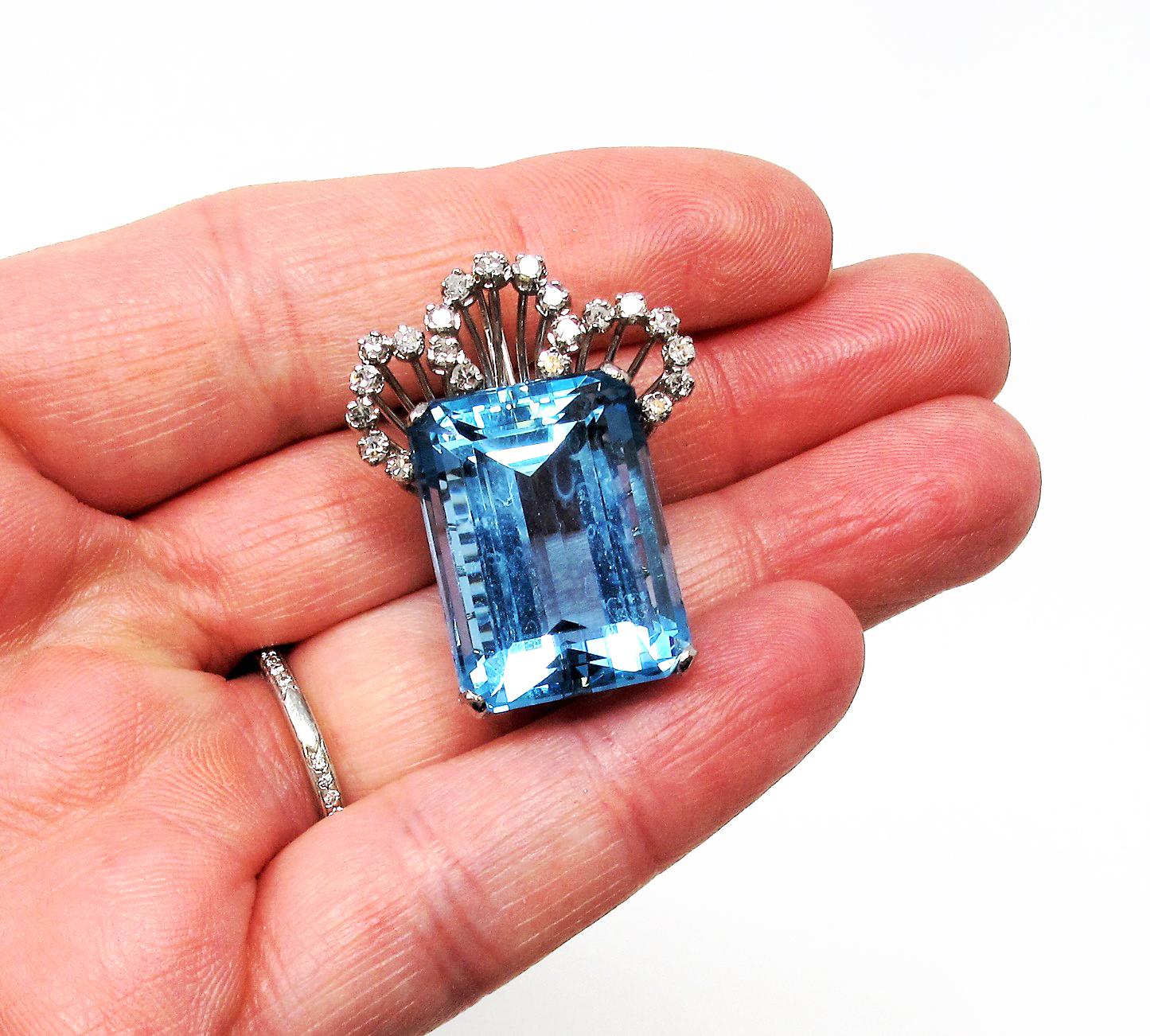 Absolutely breathtaking aquamarine and diamond brooch / pendant. This incredible piece features a fairly simple design, yet is so incredibly special. The bright, crystal blue color of the stunning aquamarine pops against the icy white diamonds and