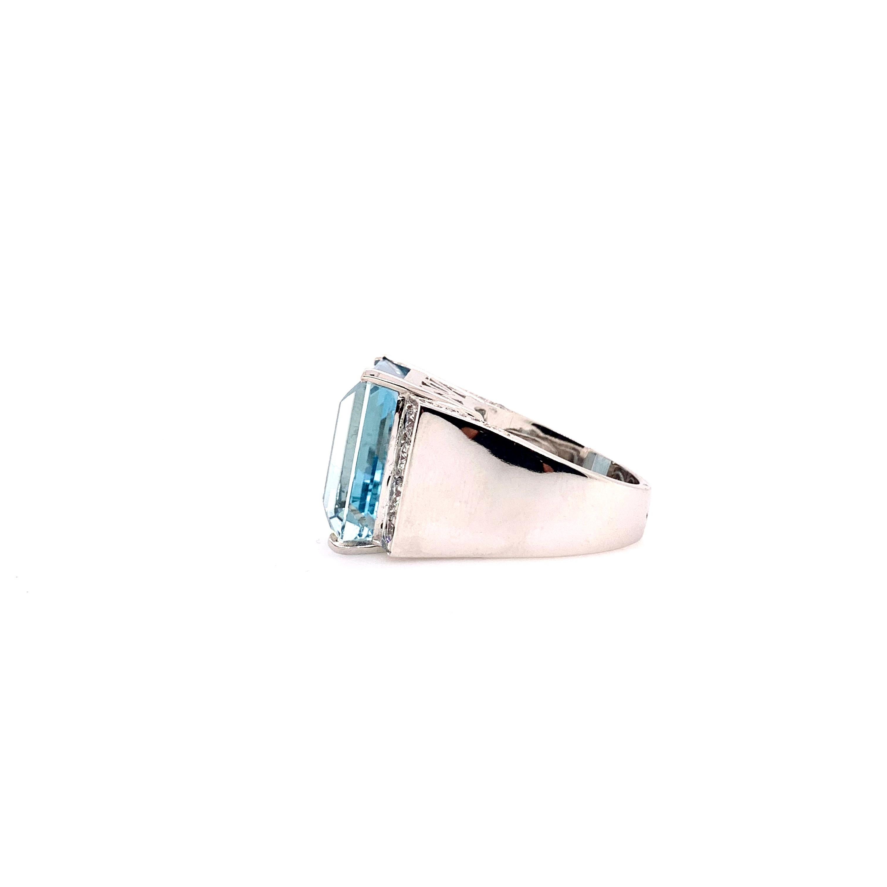 This symmetrical Aquamarine ring will captivate the audience's eyes!   The 20ct emerald cut Aquamarine has 1.15 cts of round brilliant diamonds on the shoulders of the ring.   The 14k white gold shank is generous in weight to fully support the
