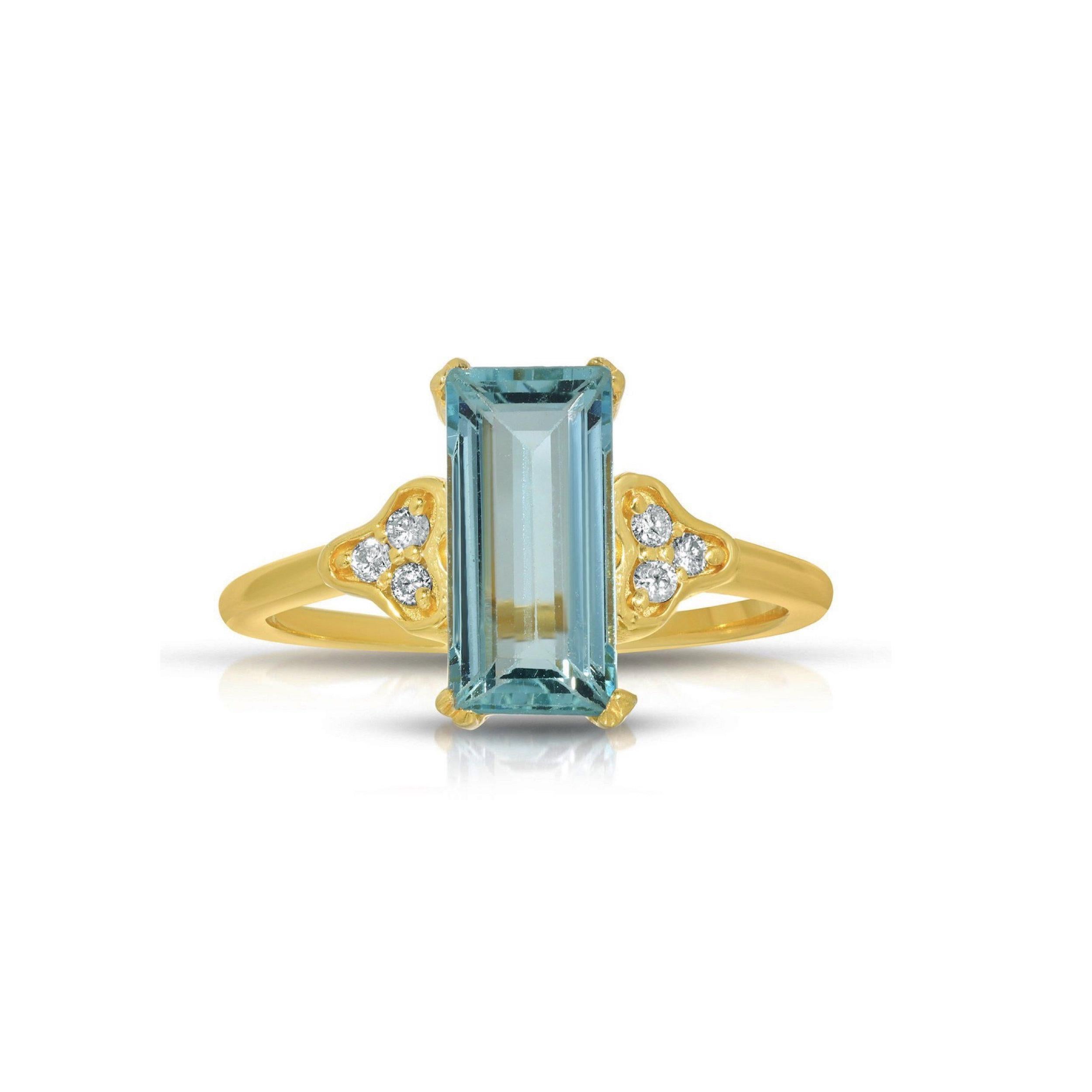 A gorgeous cocktail ring of a contemporary design with Aquamarine and Diamonds. This beautiful ring features a 2.50 Carats Emerald Cut Aquamarine centered by .08 Carats of sparkling White Diamonds. This ring is set in stylish 22 Karat Gold overlay