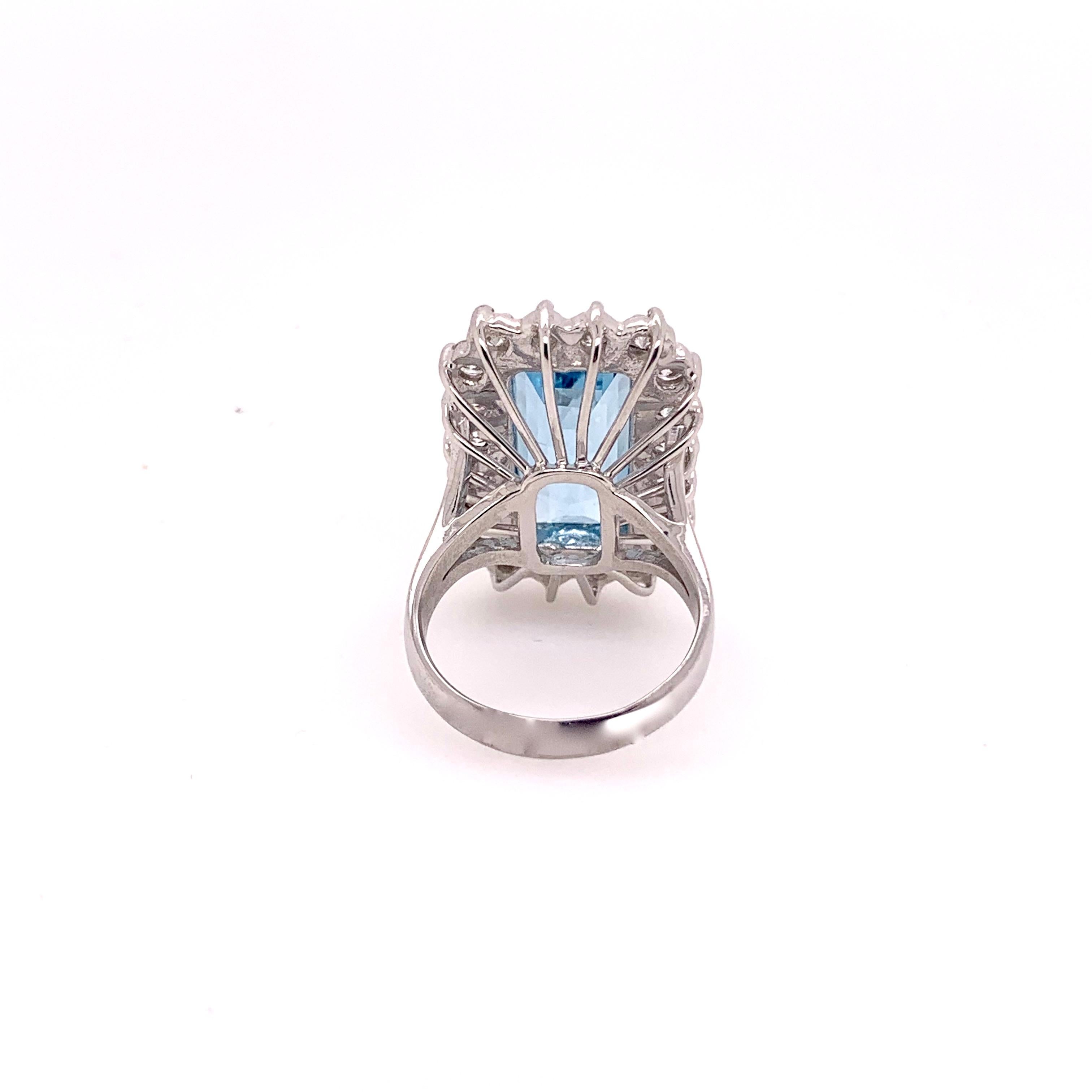 This gorgeous elongated emerald cut aquamarine is set in a classic 14k white gold setting.  The strong blue hue of the 8.93 carat aquamarine is accompanied by 2.03 carats of round brilliant diamonds in a classic prong setting.   This March