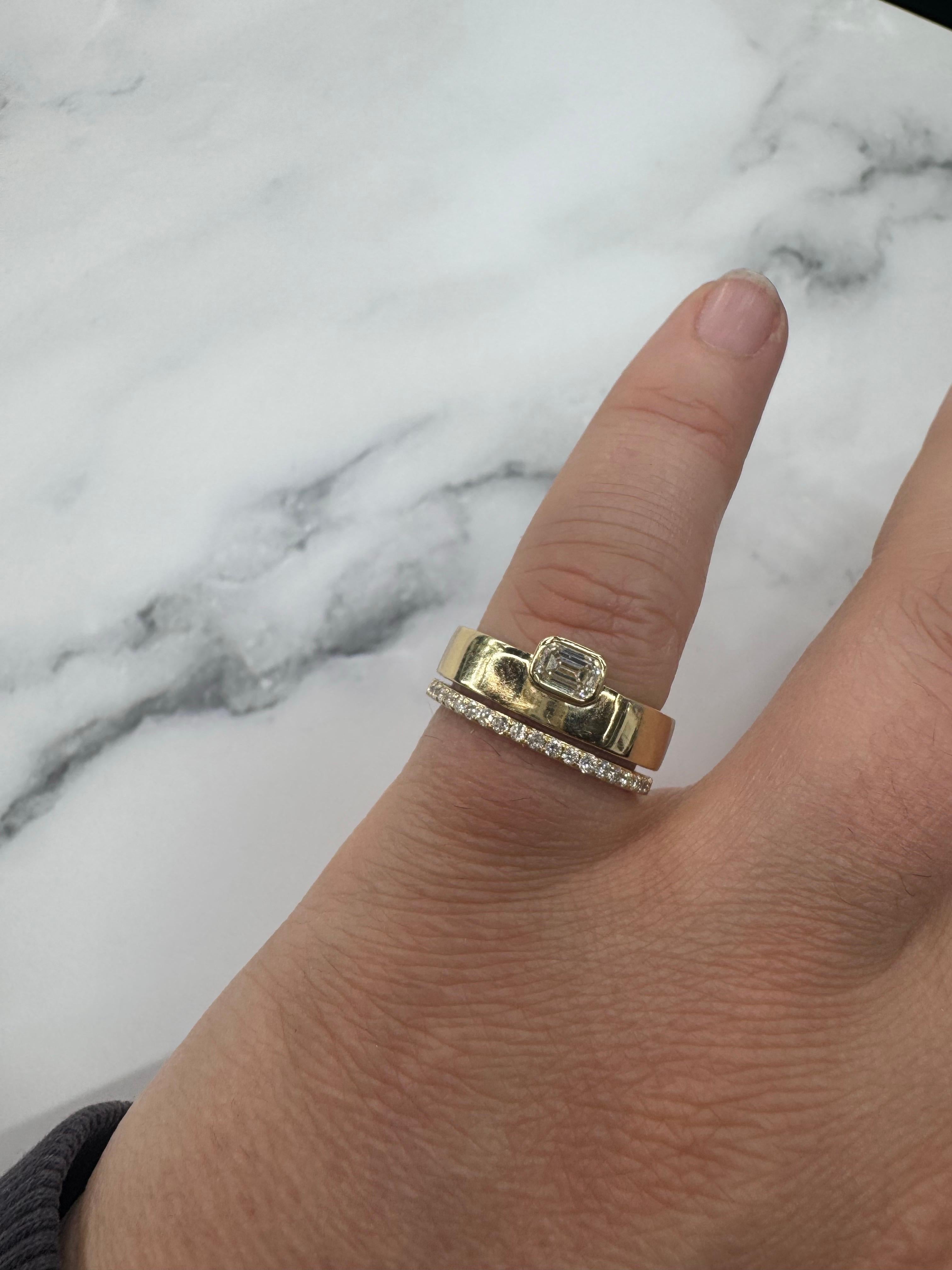 Emerald cut diamond on a bezel set band featuring a half way around diamond band on the bottom. 
Emerald 0.27 Carats 
11 Rounds 0.15 Carats
Size 5.75. Can Order Any Size & Gold. 

Message for Pictures & Details. 
Search Harbor Diamonds