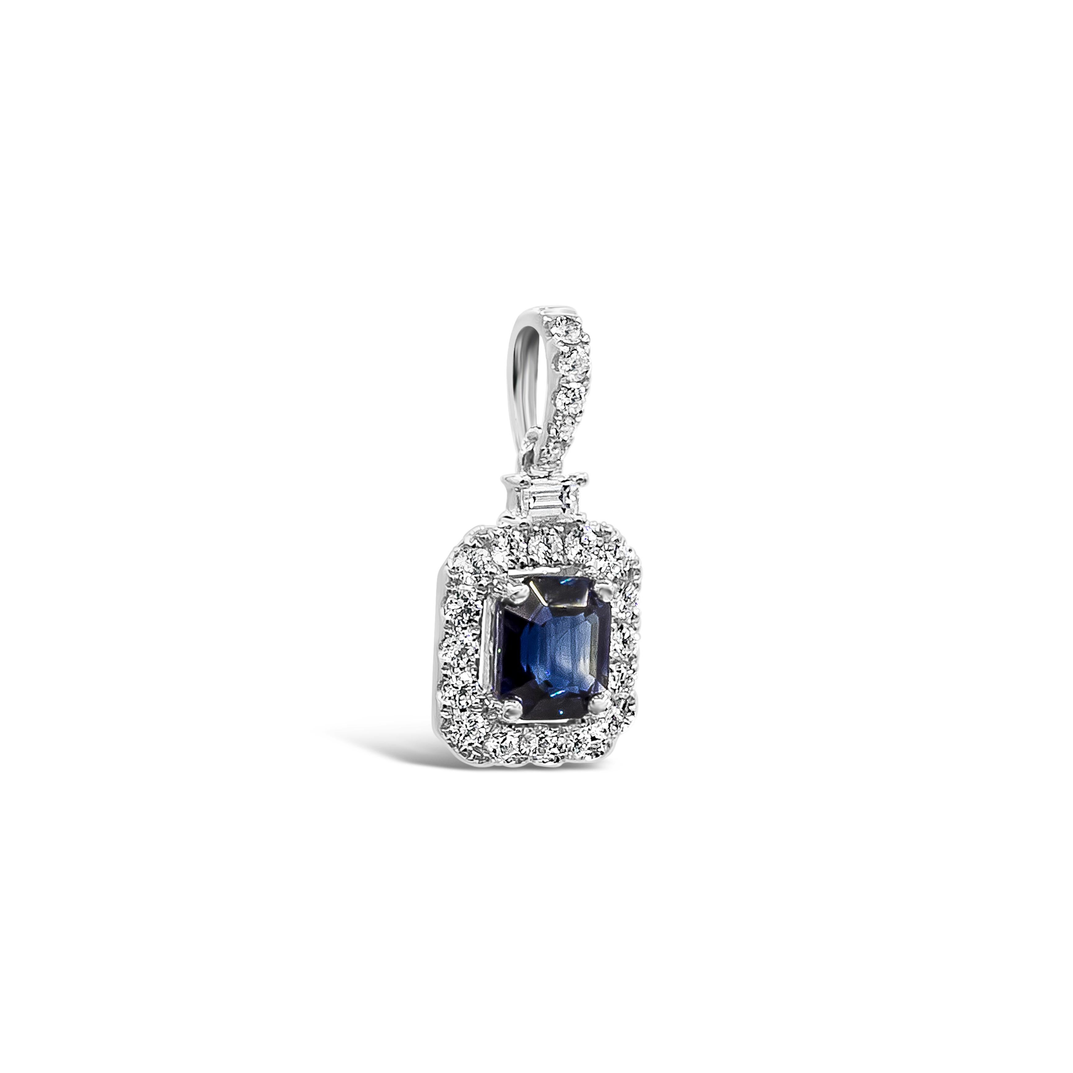 A beautiful and unique pendant necklace style showcasing a 1.64 carats emerald cut blue sapphire, surrounded by a single row of brilliant round diamond weighing 0.43 carats total. Suspended on a single baguette cut diamond and 16 inches adjustable