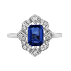 Emerald Cut Blue Sapphire and Diamond Halo Ring in 18K White Gold