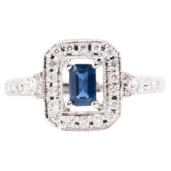 Emerald Cut Blue Sapphire and Diamond Vintage Halo Ring in 14 Carat White Gold 