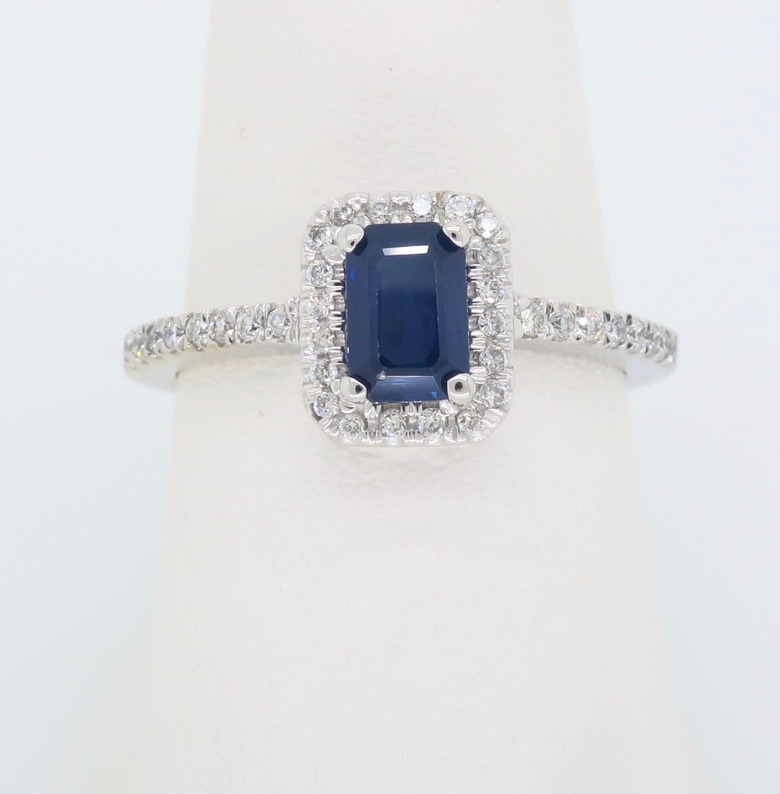 Halo style sapphire and diamond ring crafted in 14k white gold. 

Gemstone: Sapphire & Diamonds
Gemstone Carat Weight:  Approximately .63CT
Diamond Carat Weight:  Approximately .20CTW
Diamond Cut: Round Brilliant Cut
Color: Average G-J
Clarity: