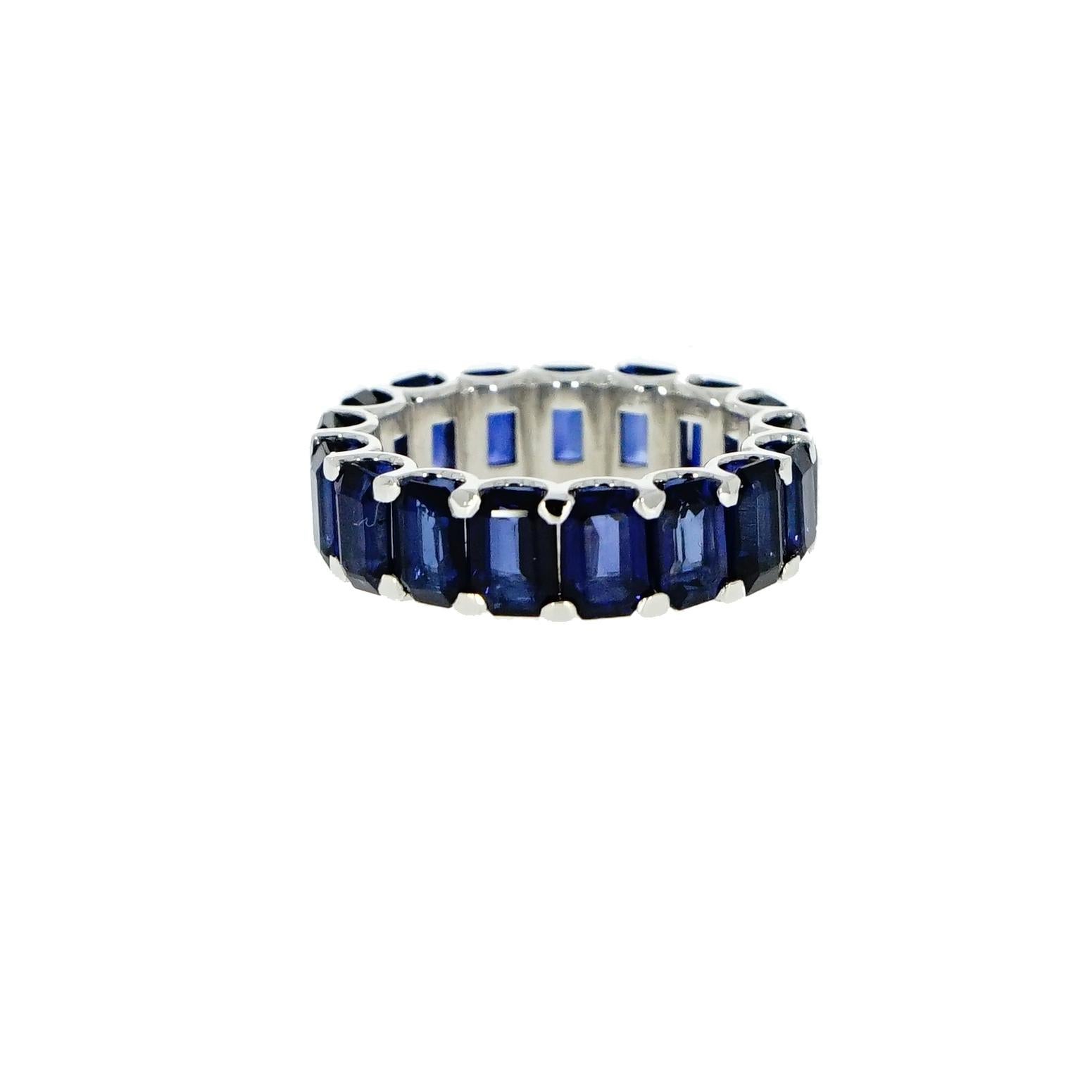 A timeless ring, Blue Sapphire Eternity Band. 
Crafted in 18k White Gold with 17 emerald-cut Sapphires totaling 10.86 carats. 
This design is one for the classics, handmade in Italy for a finger size 7
