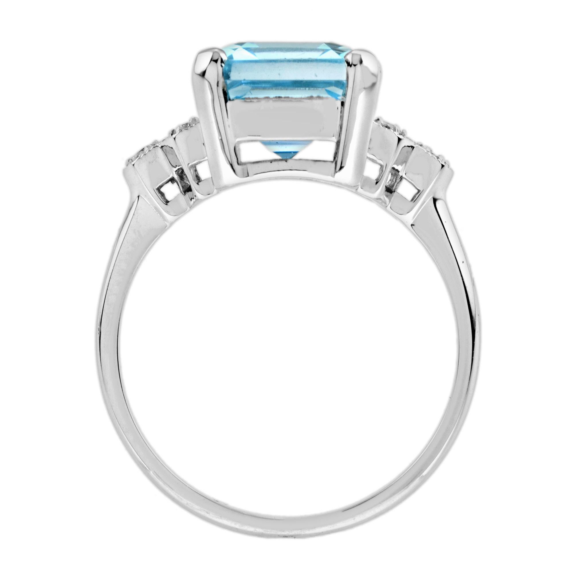 Women's Emerald Cut Blue Topaz and Diamond Solitaire Ring in 9k White Gold For Sale