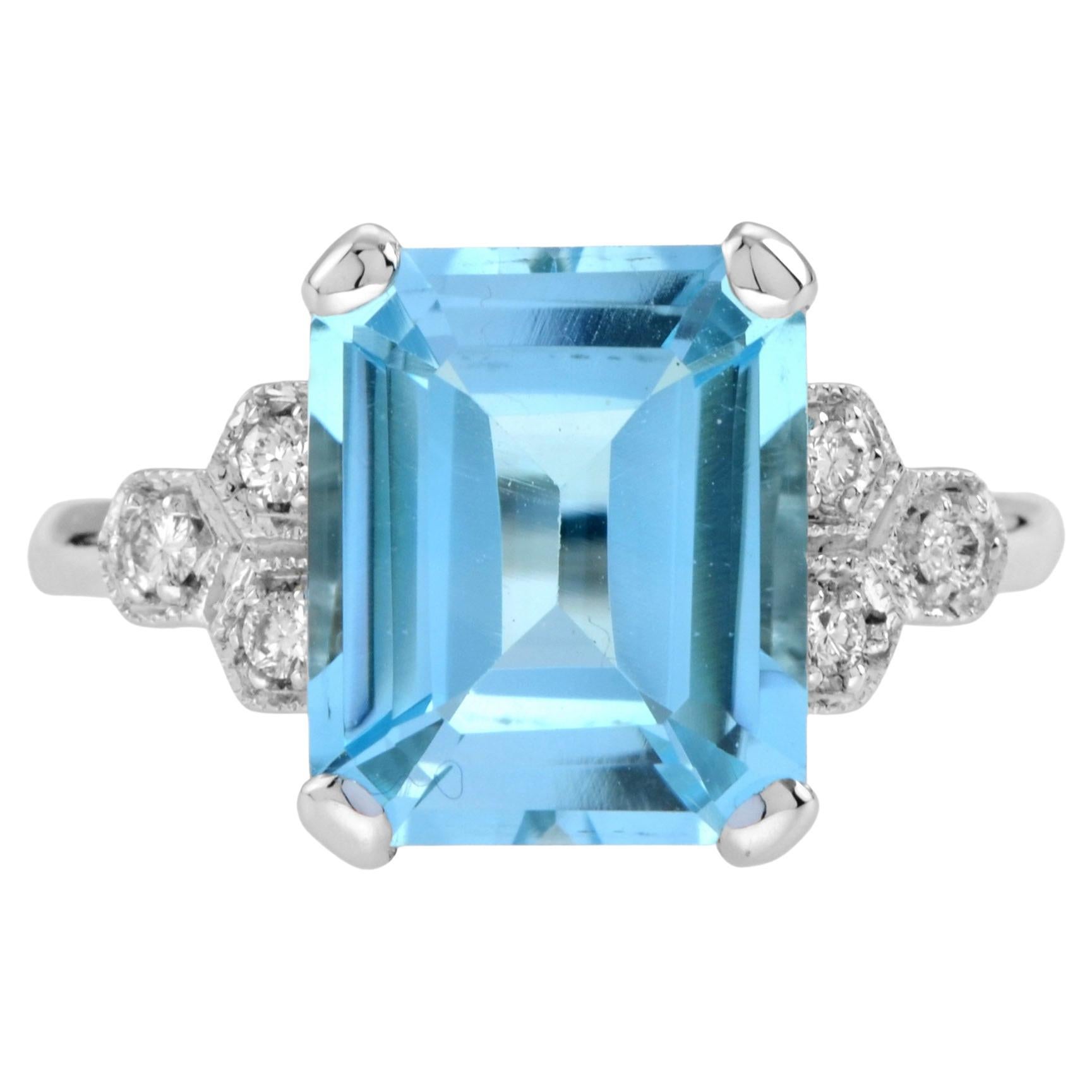 Emerald Cut Blue Topaz and Diamond Solitaire Ring in 9k White Gold For Sale