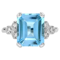 Anillo Solitario de Topacio Azul Corte Esmeralda y Diamante en Oro Blanco de 9k