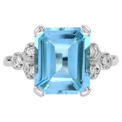 Emerald Cut Blue Topaz and Diamond Solitaire Ring in 9k White Gold