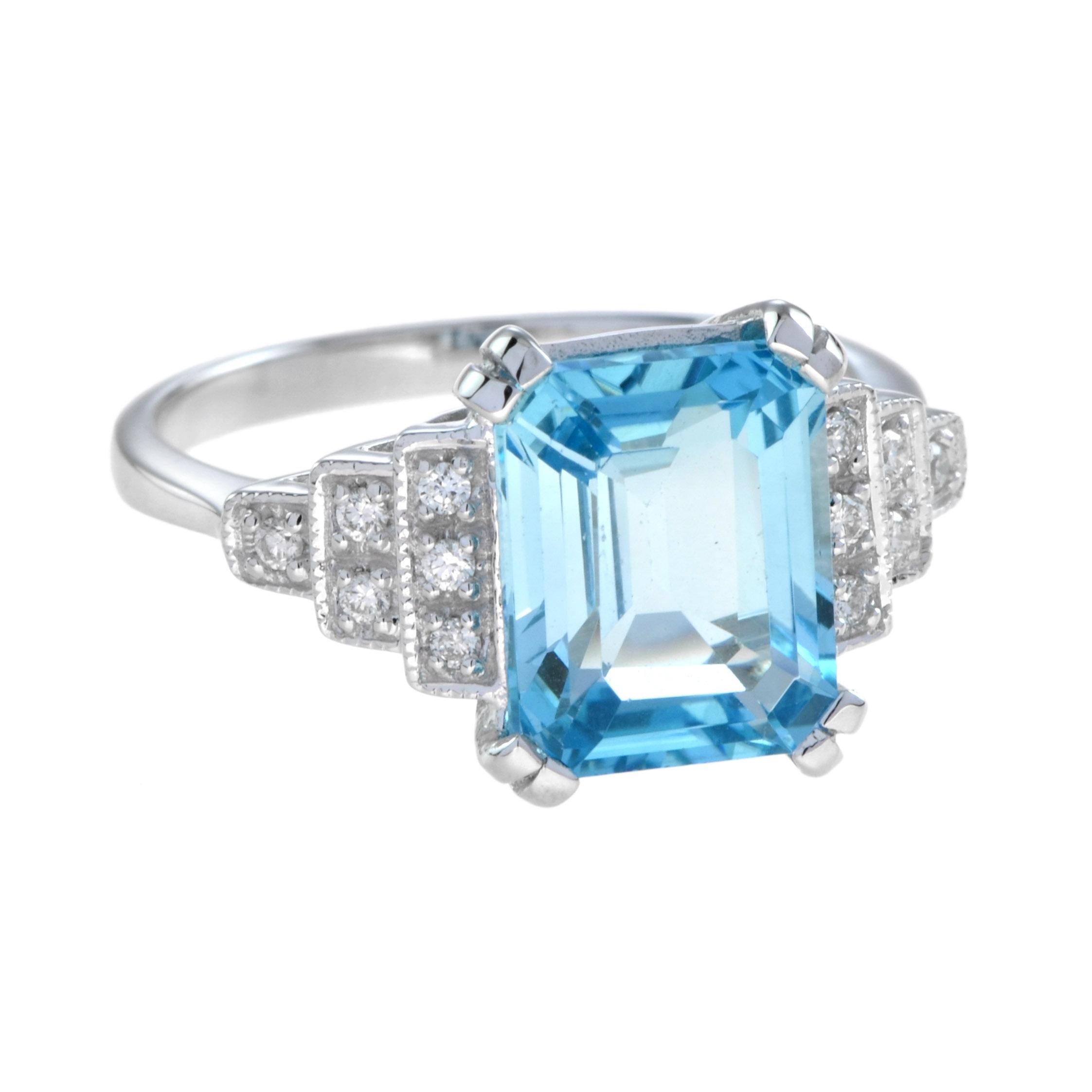 Women's Emerald Cut Blue Topaz and Diamond Step Shoulder Engagement Ring in 9K Gold For Sale