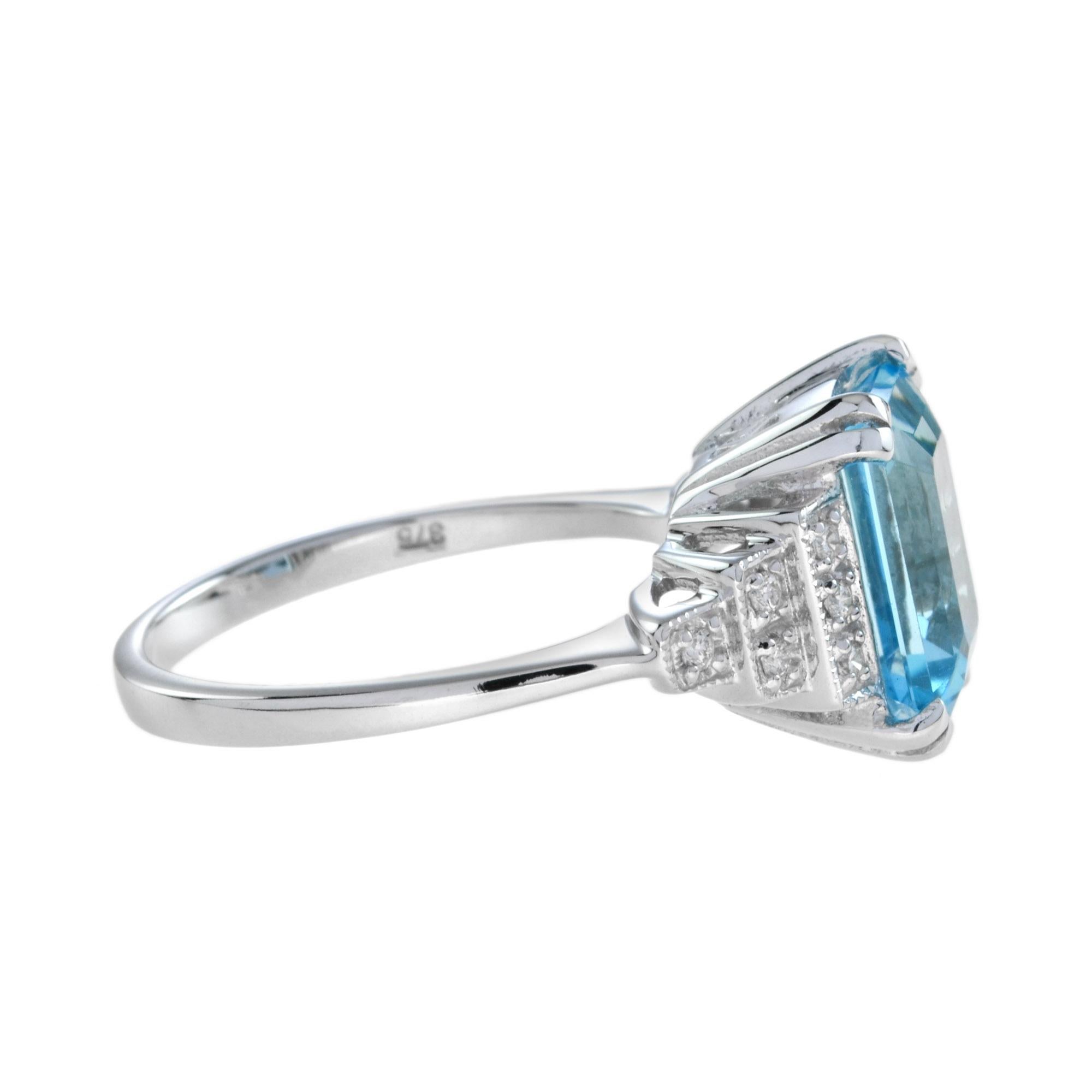 Emerald Cut Blue Topaz and Diamond Step Shoulder Engagement Ring in 9K Gold For Sale 1