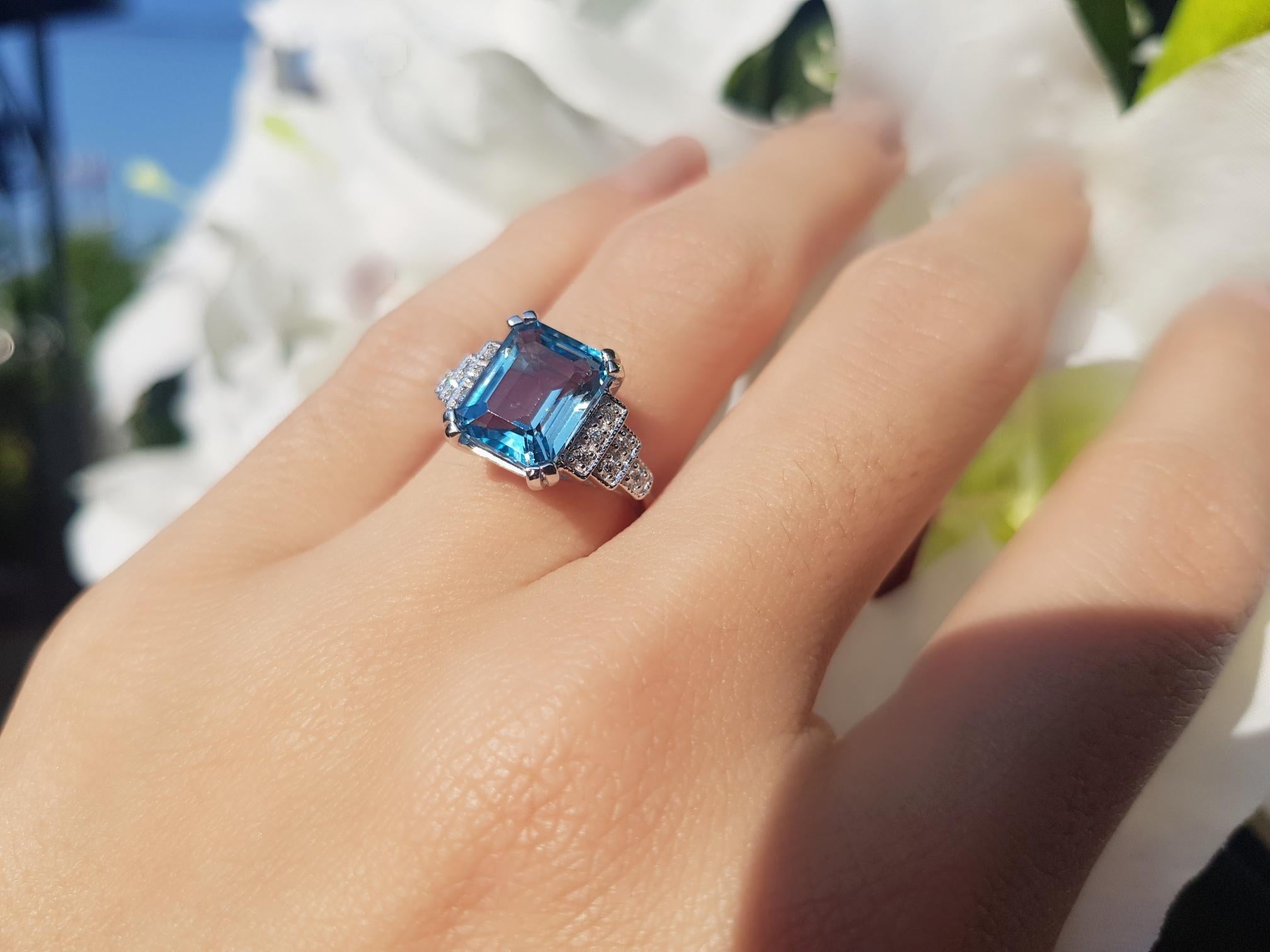 Art Deco Emerald Cut Blue Topaz and Diamond Step Shoulder Engagement Ring in 9K Gold For Sale