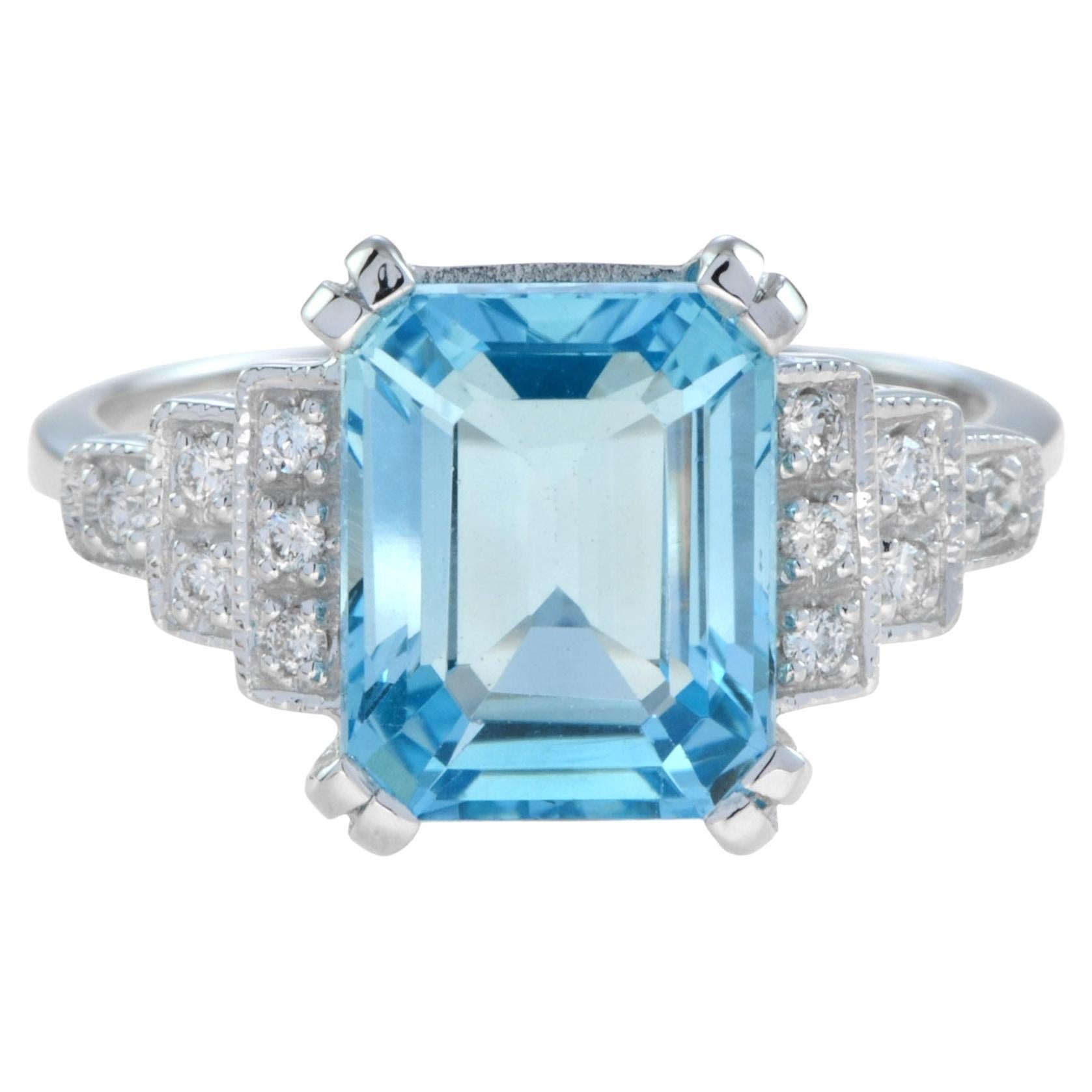 Emerald Cut Blue Topaz and Diamond Step Shoulder Engagement Ring in 9K Gold For Sale