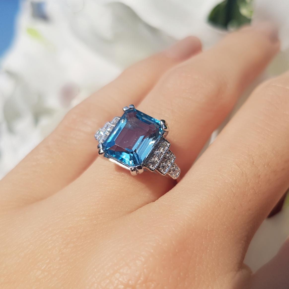 For Sale:  Emerald Cut Blue Topaz and Step Diamond Engagement Ring in 18K White Gold 9