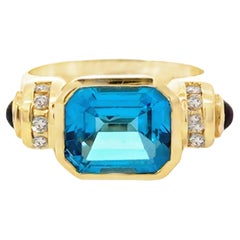 Emerald Cut Blue Topaz Diamond and Garnet Ring 14K Yellow Gold