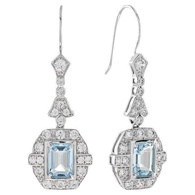 Orecchini a goccia in stile Art Deco con diamante e topazio blu taglio smeraldo in oro bianco 18 carati