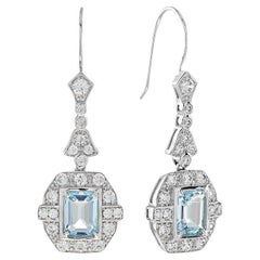 Orecchini a goccia in stile Art Deco con diamante e topazio blu taglio smeraldo in oro bianco 18 carati