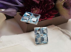 Emerald Cut Blue Topaz Grid Stud Earrings in Sterling Silver