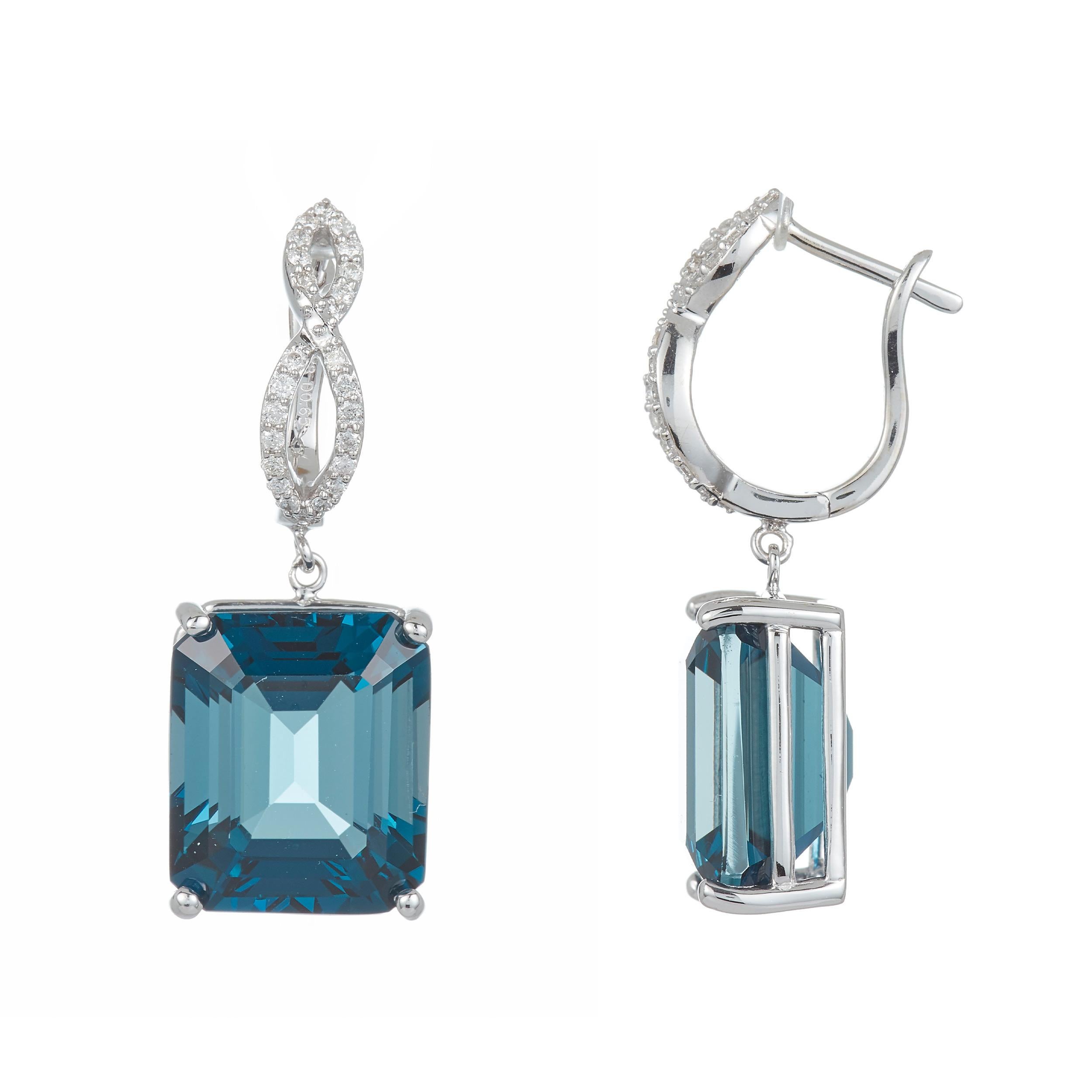 Stones: 2 Emerald Cut Blue Topaz at 24.15 Carats Total Weight
Accent Stones: 48 Round Brilliant Diamond at 0.40 Carats Clarity: SI / Color: H-I
Metal: 14K White Gold

Fine one-of-a-kind craftsmanship meets incredible quality in this breathtaking