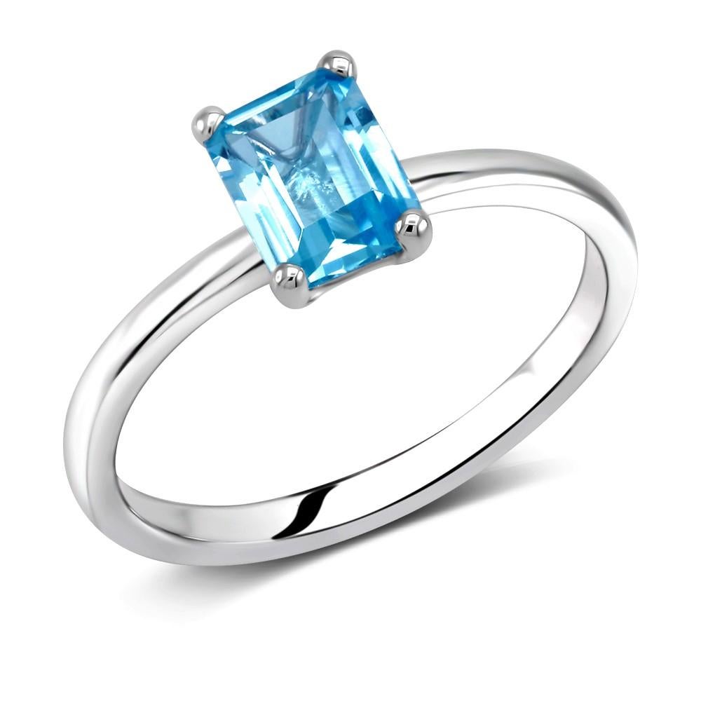 Sterling Silver solitaire emerald cut ring 
Blue Topaz weighing one carat
Blue topaz measuring 7x5 millimeter 
Ring finger size 6.5
New Ring
The ring can be resized
White gold plated 
Handmade in the USA
