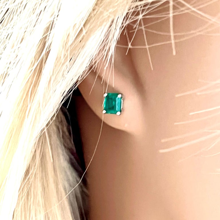 Fourteen karats white gold Colombia emerald stud earrings 
Two emerald weighing 1.25 carats
Width of the earrings 0.25 inch
New Earrings
Our design team select gemstones for their quality, aesthetic beauty, and sale value of the featured item
For