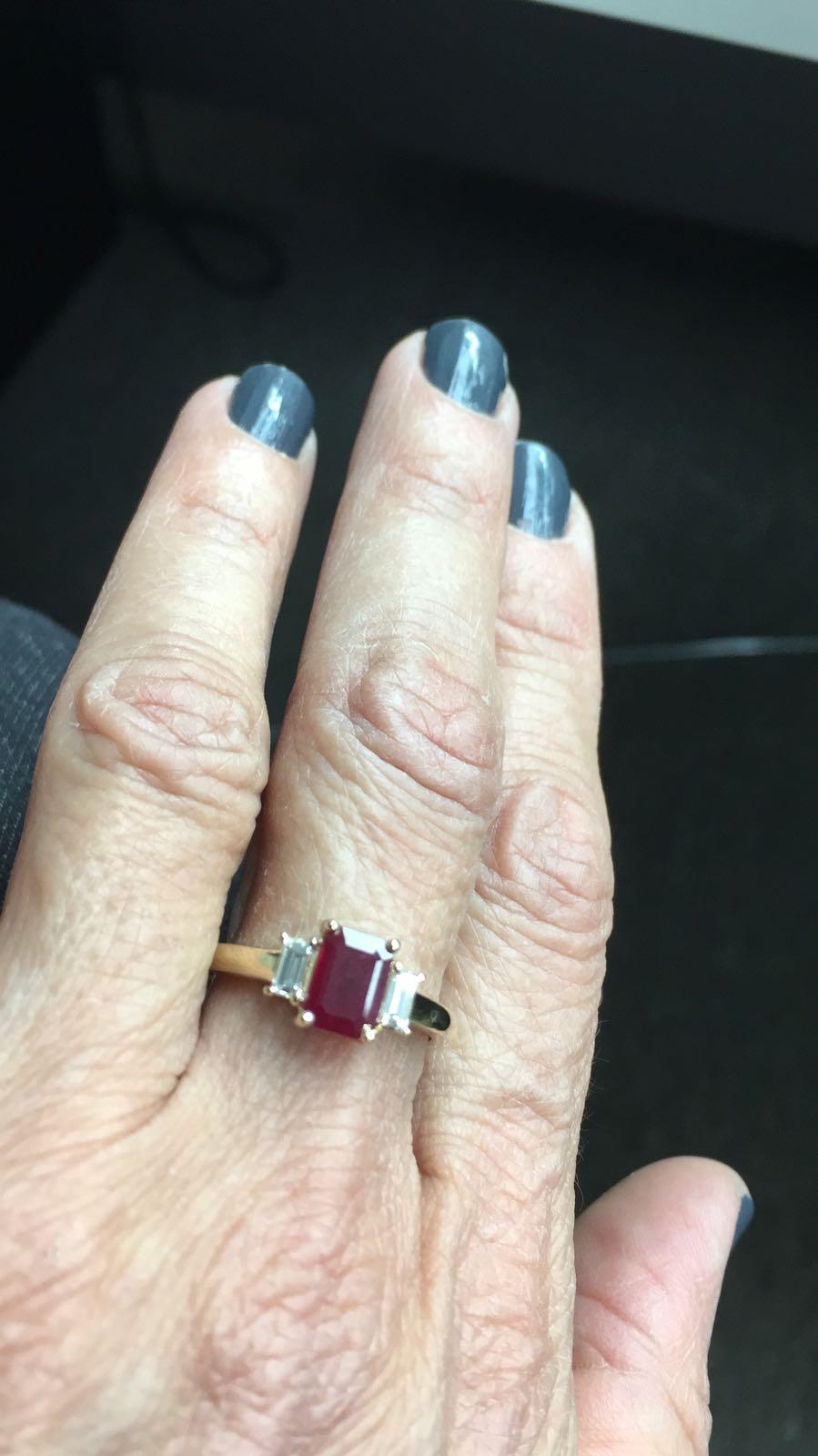  The emerald cut / cushion ruby in this ring has a total carat weight of 0.98 carats. The diamonds have a total carat weight of 0.30 carats.

All our Gemstones are genuine, and are sourced with the highest degree of integrity.
