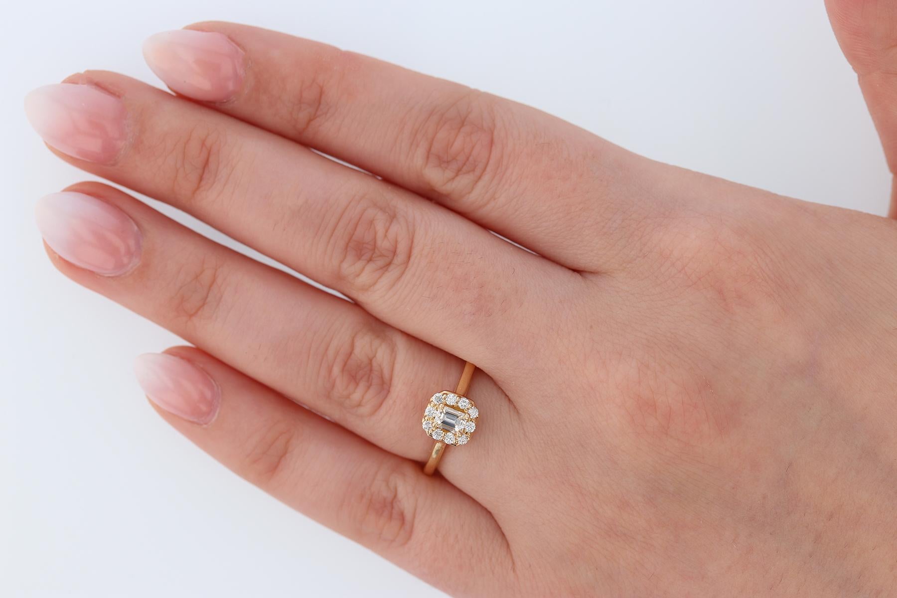 Modern Emerald Cut Diamond 14 Karat Yellow Gold Engagement Ring For Sale