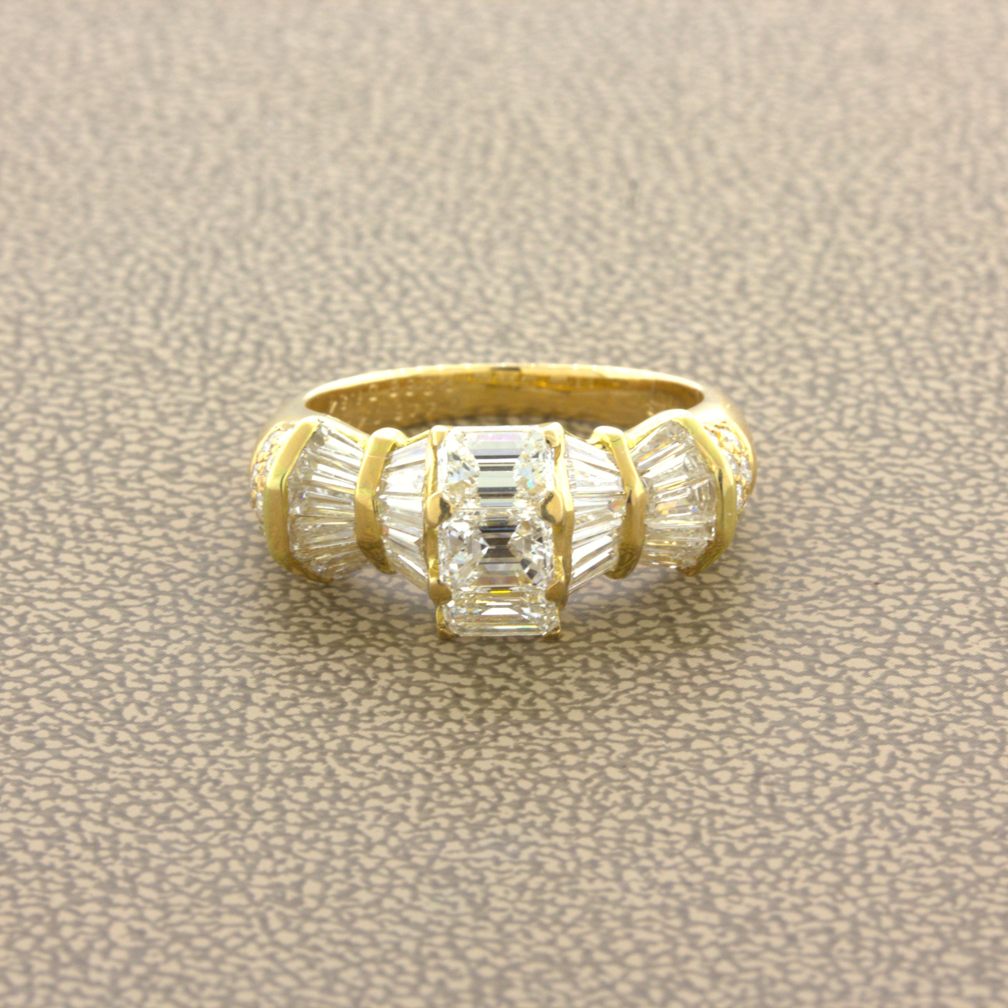 An elegant and unique diamond ring! It features 3 large bright white VS emerald-cut diamonds running vertically down the center of the piece. Adding to that are angled baguette-cut diamonds and round brilliant-cut diamonds set on the sides of the