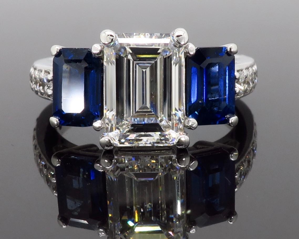 emerald cut diamond ring with sapphire side stones