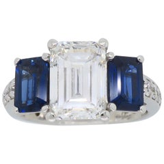 Emerald Cut Diamond and Blue Sapphire Three-Stone Engagement Ring