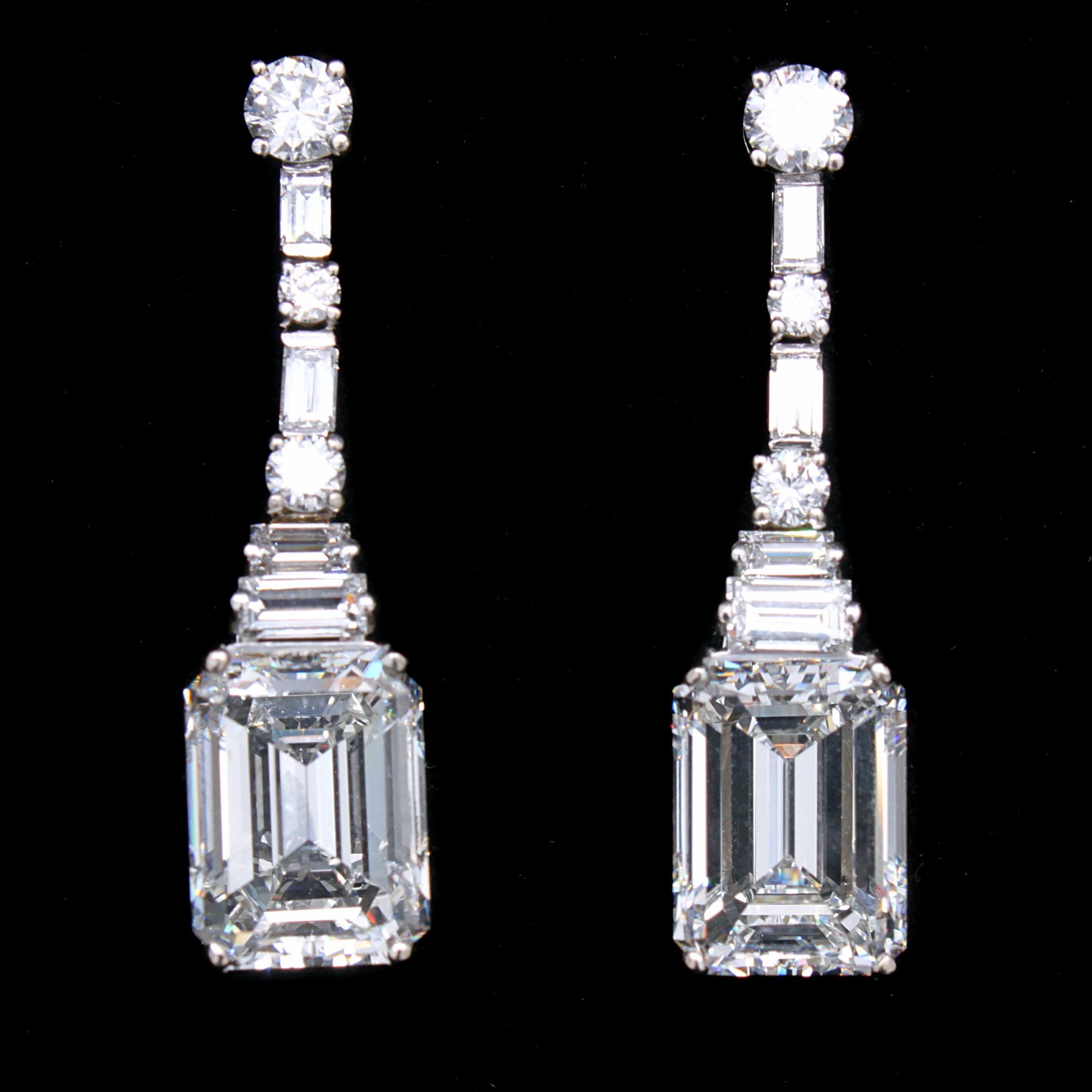 A stunning pair of emerald cut diamond Art Deco earrings, ca. 1930s. 

The two large stones weigh 5.37ct (H-VVS2, potentially IF) and 5.26ct (H-VS1) respectively - accompanied by GIA certificates. They are topped by round brilliant cut diamonds and