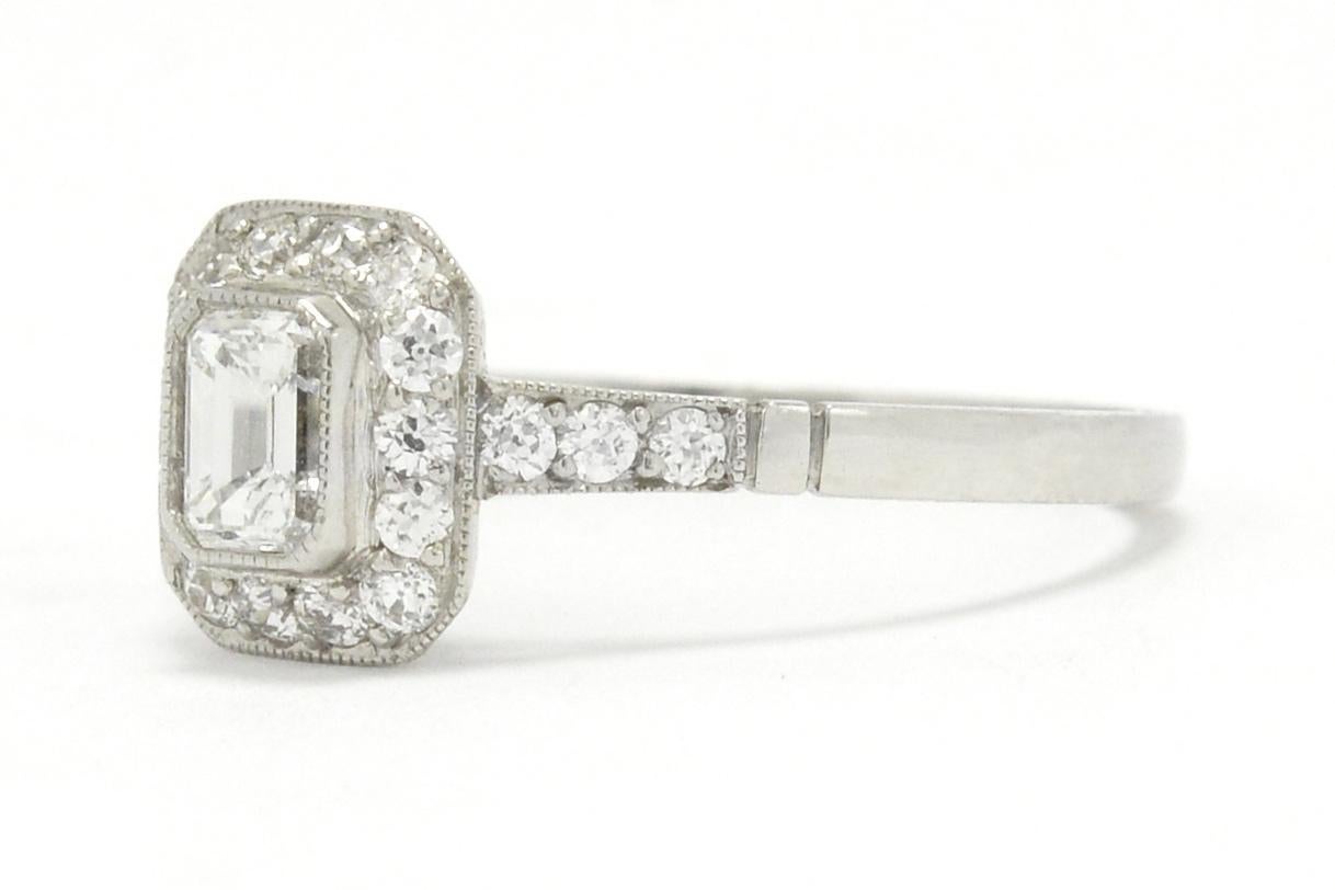 bezel set emerald cut diamond ring