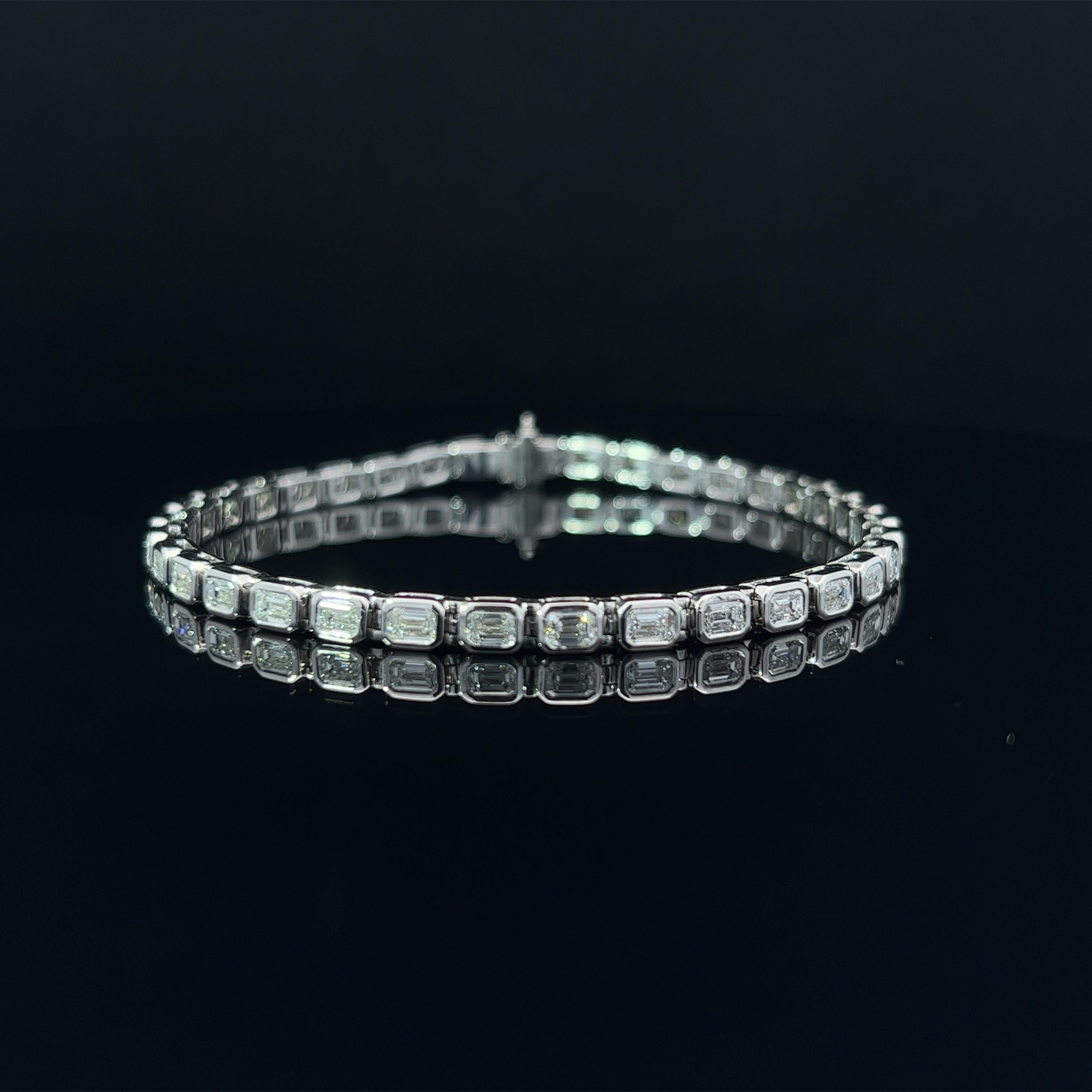 Diamond Shape: Emerald Cut  
Total Diamond Weight: 4.3ct
Individual Diamond Weight: .10ct
Color/Clarity: FG VVS  
Metal: 18K White Gold 
Metal Weight: 14.19g

Key Features:

Emerald-Cut Diamonds: The centerpiece of this bracelet is a series of
