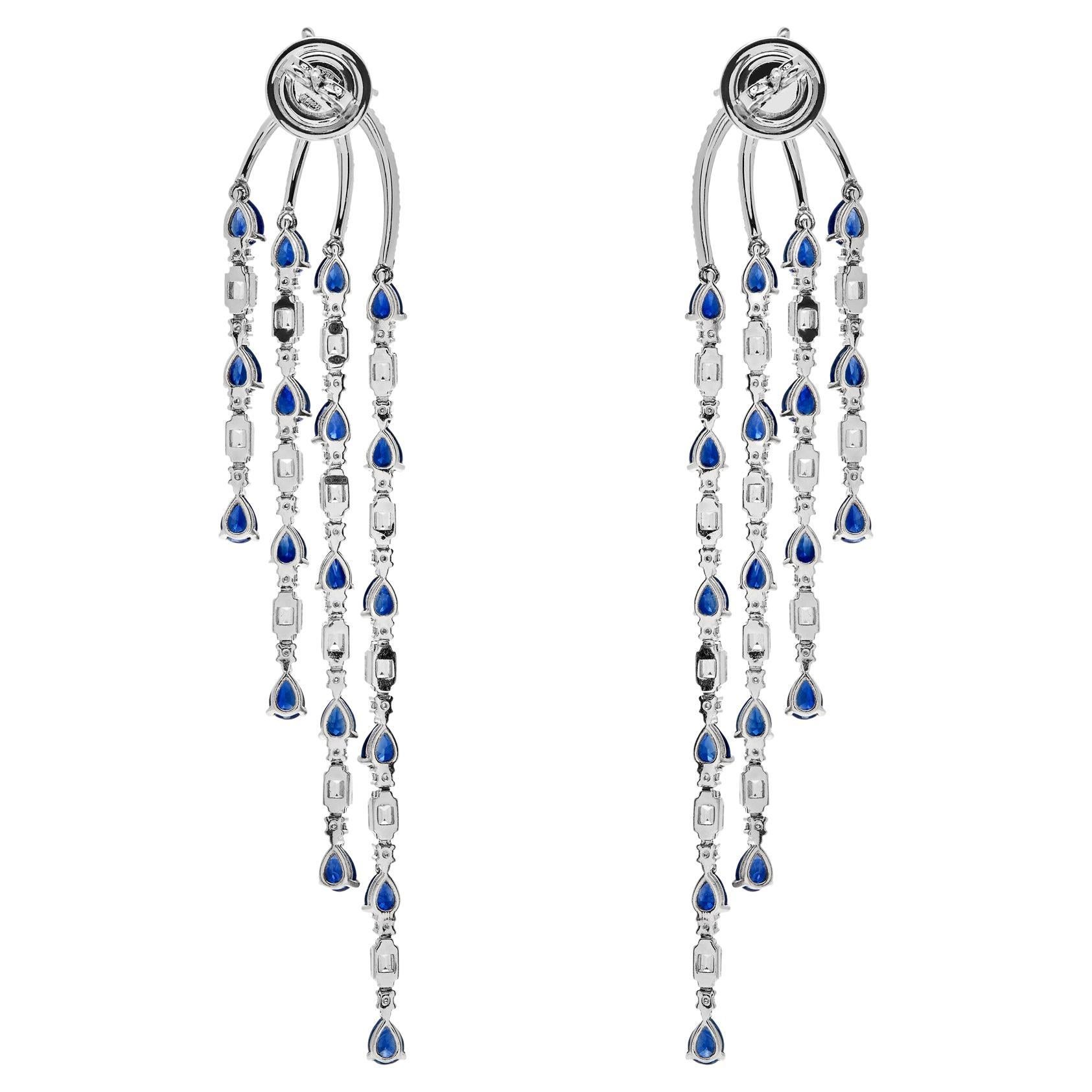 Elevate your ensemble with these stunning Diamond & Blue Sapphire Chandelier Earrings. With a weight of 18.59 grams of 18-karat white gold, these earrings offer both style and comfort. The dazzling combination of 5.10 carats of emerald and round