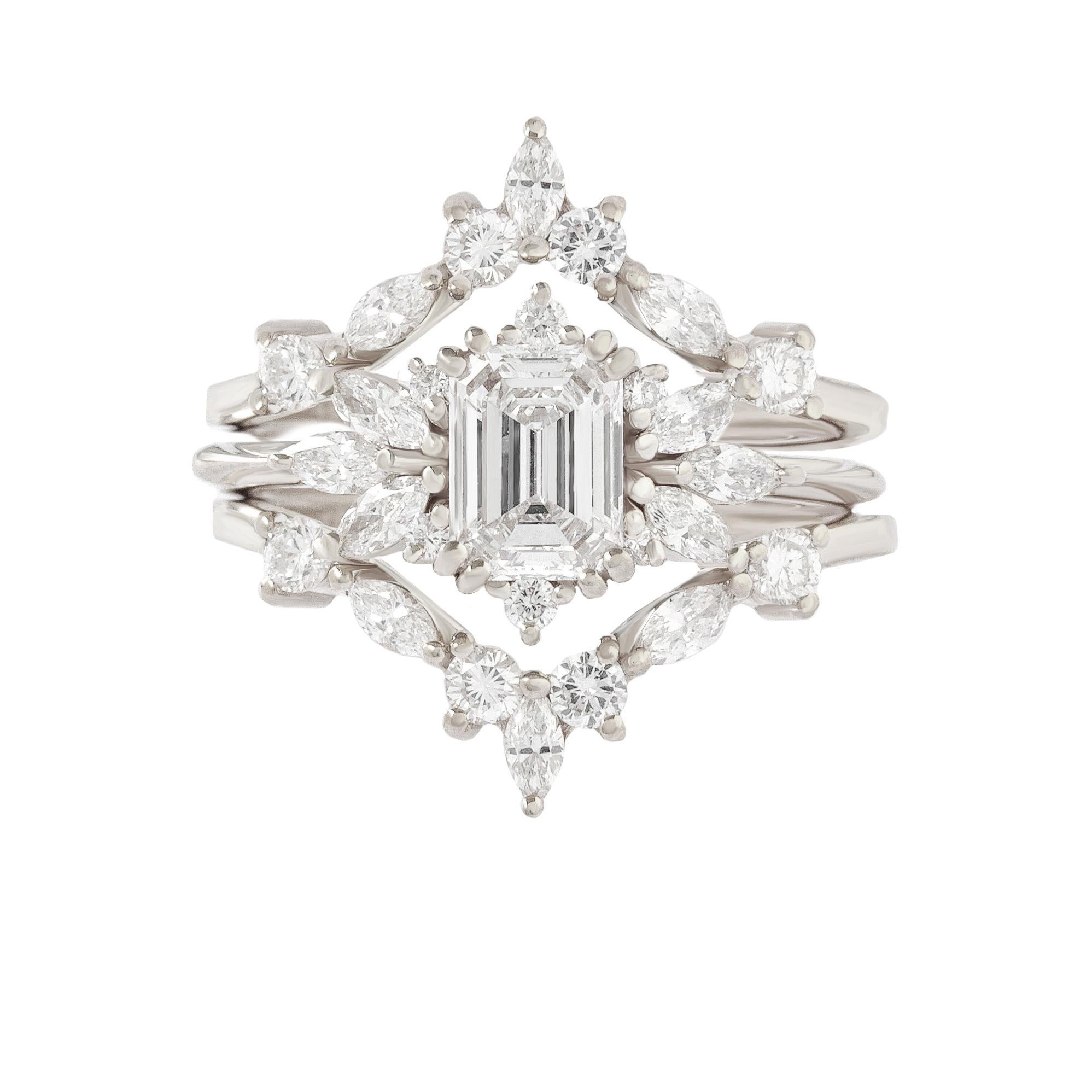 Make a bold statement with this elegant Emerald Cut Diamond Engagement Ring Set. The 