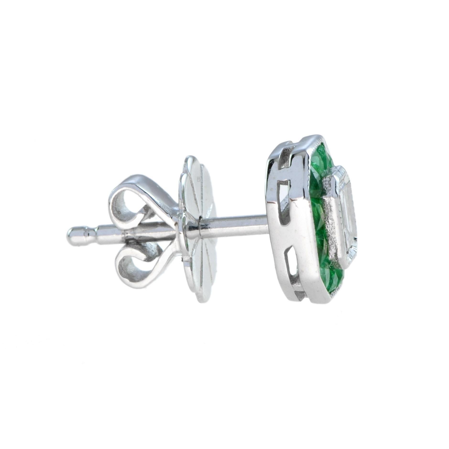 These Art-Deco stud earrings are completely spectacular! The vibrant color stone (you can select Blue Sapphire, Emerald, or Ruby) is a specialty cut to surround the excellent emerald  cut center diamond, which is in a thin bezel with milgrain