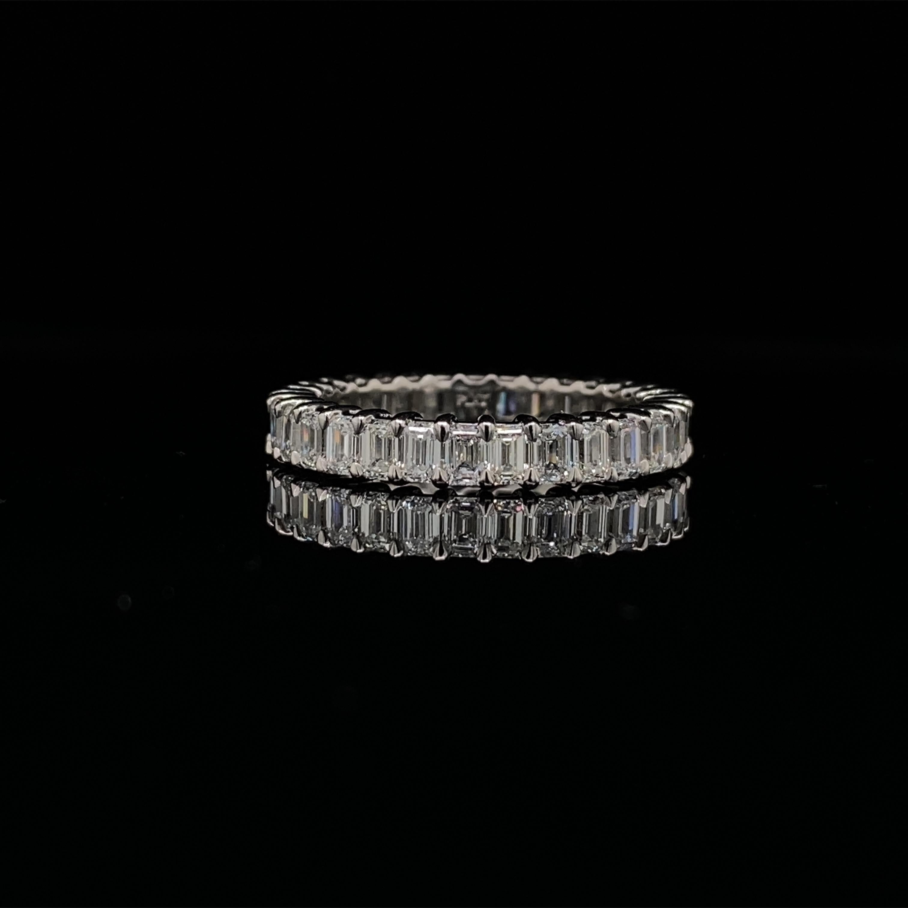 This Emerald cut diamond Eternity band has 31 Emerald cut diamonds.
The diamonds have a total carat of 2.51.
The diamonds are F-G color, VS clarity.
The ring is a finger size 6.5 and is set in platinum.