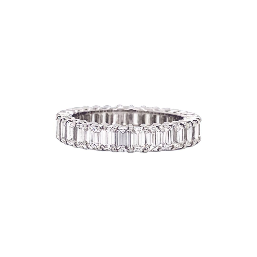 This is a stunning Emerald Cut diamond Eternity band.
This ring has 31 diamonds with a total carat of 3.07.
The diamonds are H color VS clarity. The diamonds are average 10 Pointers.
This ring is a size 6.25 and is set in Platinum.

