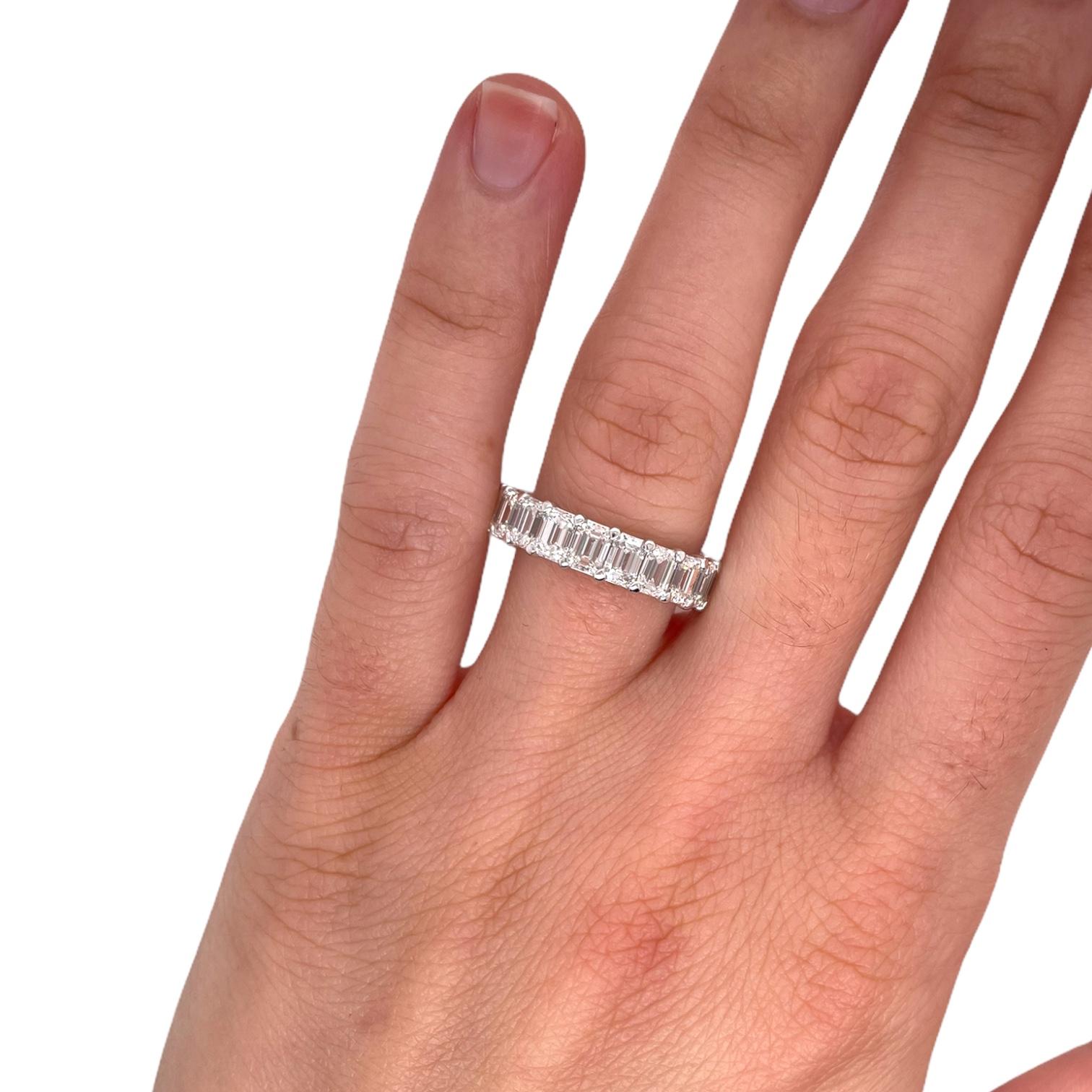 Ring contains 21 finely matched emerald cut diamonds, 5.58tcw. Diamonds are G in color and VS2 in clarity. All stones are mounted in a handmade basket prong setting in 18k white gold. Ring is a size 6. If different size is needed, please request