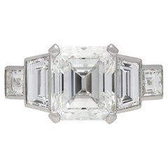 Emerald-Cut Diamond Flanked Solitaire Ring, circa 1950