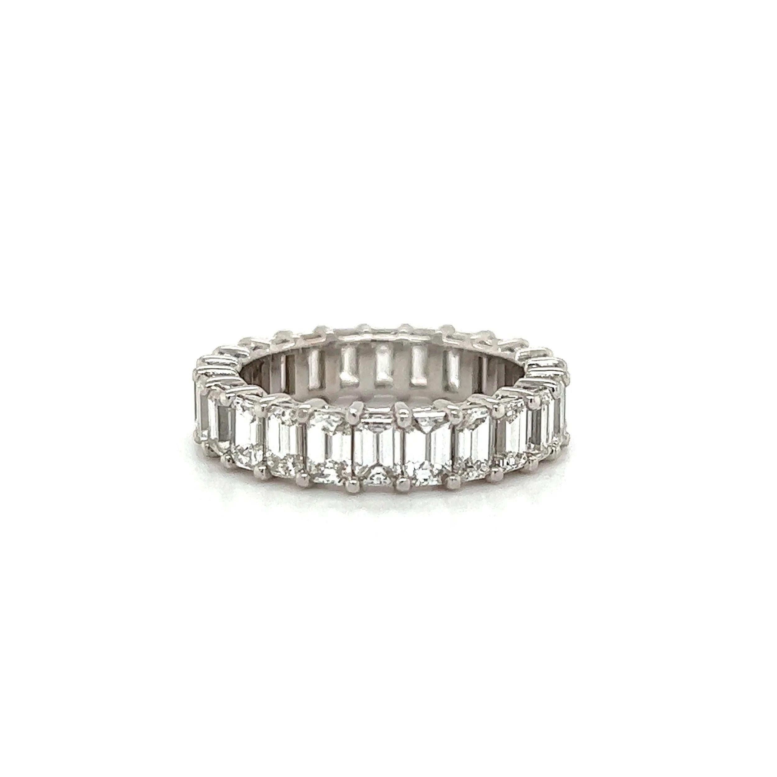 Simply Beautiful! Finely detailed Diamond Eternity Band Ring. Securely nestled Hand set 44 Emerald Cut Diamonds, weighing approx. 4.41tcw; G-VS Quality. Hand crafted 18K White Gold mounting. Ideal worn alone or as an alternative Engagement ring or